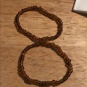 Two brown bracelets